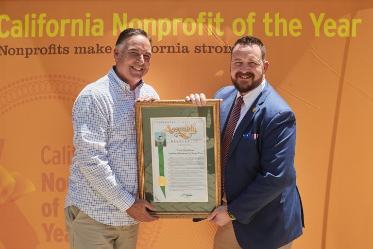 Mathis presents a resolution to the 2022 Non-Profit of the year